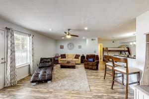 a living room with a couch and a table at Indian Lake 317 in Destin