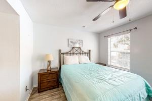 a bedroom with a bed and a window at Indian Lake 317 in Destin