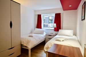 Postelja oz. postelje v sobi nastanitve 62-66 Farringdon Apartments by condokeeper