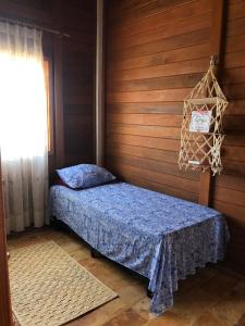 Ένα ή περισσότερα κρεβάτια σε δωμάτιο στο Chalé Bela Vista +42 φωτογραφίες