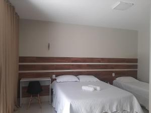 Ліжко або ліжка в номері FlatStudio05 em condomínio residencial na Nova Betânia