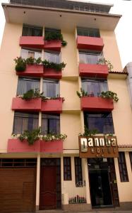 a building with a sign for a dancing hub at DANOBA HOTEL in Cajamarca