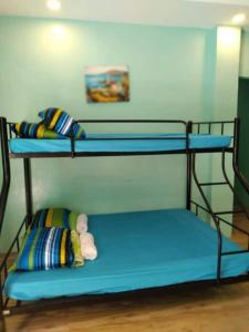 Postel nebo postele na pokoji v ubytování Azulea Lodging House Oslob