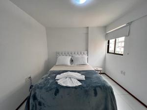 Rúm í herbergi á Apartamentos 250m da Orla -Edifício Nugali- Castelo B Temporada
