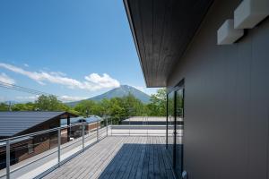 a balcony with a view of a mountain at Aozora in Kutchan
