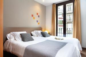 Posteľ alebo postele v izbe v ubytovaní Feelathome Center Apartments