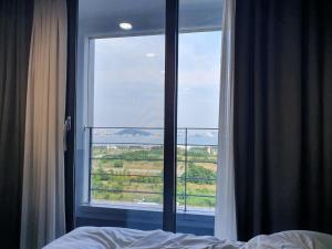 Postel nebo postele na pokoji v ubytování Incheon Rivieraverium Hotel