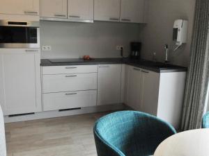 O bucătărie sau chicinetă la Vlaanderen Cozy Cottage