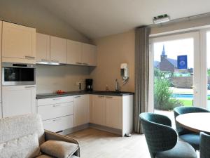 O bucătărie sau chicinetă la Vlaanderen Cozy Cottage