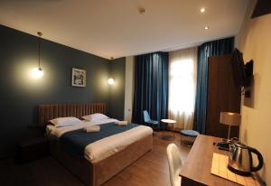 Un pat sau paturi într-o cameră la Hotel Verisima