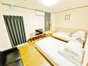 Llit o llits en una habitació de Petit Hotel 017 - Vacation STAY 60631v