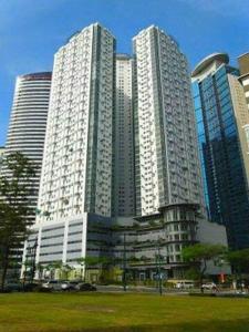 a group of tall buildings in a city at 2 BR loft-type condo Fort Victoria in Manila