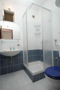 a bathroom with a shower and a toilet and a sink at Apartments with a parking space Vis - 8938 in Vis +31 photos