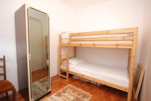 a mirror in a room with two bunk beds at Apartments by the sea Vis - 8906 in Vis