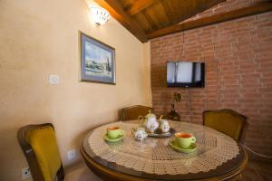 a dining room table with a tea set on it at Apartments by the sea Vis - 8930 in Vis
