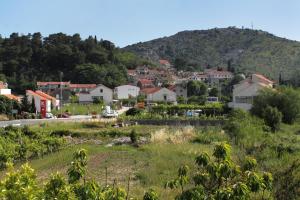 a view of a town with a mountain in the background at Apartments with a parking space Srebreno, Dubrovnik - 9028 in Mlini