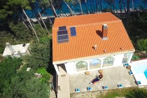an overhead view of a house with an orange roof at Secluded fisherman's cottage Cove Spiliska, Korcula - 9142 in Vela Luka