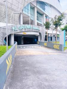 a building with a tunnel in front of it at Connected train 3 Bedrooms - ABOVE KLGATEWAY MALL 14 in Kuala Lumpur