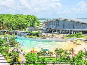 un artista representando el exterior del edificio del centro de convenciones en ZEN FORESHORE: 3-BR Nightcliff Foreshore-Front Apt en Nightcliff