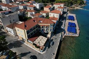 an aerial view of a house next to the water at Hotel Miramare in Pylos