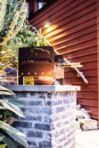 a box sitting on top of a brick wall at La tanière Dinant in Dinant