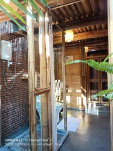 a bathroom with a toilet in a building at สวนเกษตรรักษ์ไผ่ Bamboo Conservation Farm in Surin +93 photos