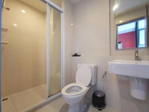 a bathroom with a toilet and a shower and a sink at The Base Condo in Pattaya +23 photos