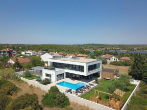 an aerial view of a house with a swimming pool at Villa Monte Kope in Banjole
