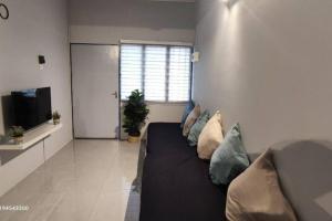 Posezení v ubytování Margosa Botani Ipoh Homestay 3BR by Grab A Stay