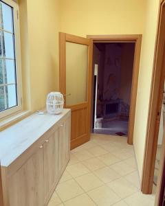 a kitchen with a door open to a room at CASINA DAMÍ in Canosa Sannita