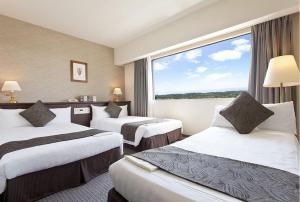Postel nebo postele na pokoji v ubytování Hotel Francs