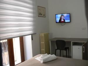 TV a/nebo společenská místnost v ubytování Locanda Pezzolla