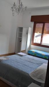 a bedroom with a large bed and a window at The Caponi Bros in Mestre