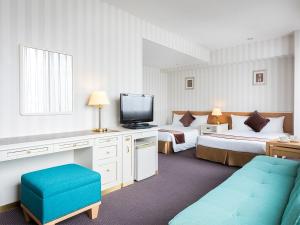 Postel nebo postele na pokoji v ubytování Hotel Francs