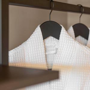 a pair of white socks hanging in front of a mirror at La maison py in Vergisson