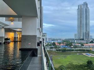 a balcony of a building with a view of a city at Twin Galaxy Suite by Nest Home in Johor Bahru