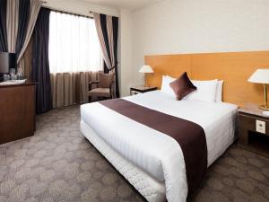 Postel nebo postele na pokoji v ubytování Hotel Francs