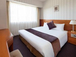 Postel nebo postele na pokoji v ubytování Hotel Francs