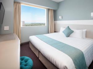 Un pat sau paturi într-o cameră la Hotel Francs