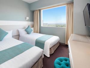 Postel nebo postele na pokoji v ubytování Hotel Francs