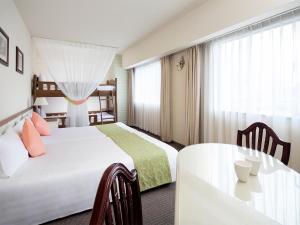 Postel nebo postele na pokoji v ubytování Hotel Francs