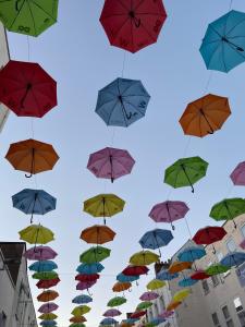 a bunch of umbrellas in the sky at The Abbey Town House - Cheltenham in Cheltenham