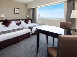 Postel nebo postele na pokoji v ubytování Hotel Francs