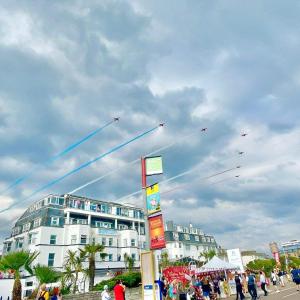 a group of kites flying in the sky over a building at Suncliff Hotel - OCEANA COLLECTION in Bournemouth