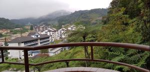 a view from a balcony of a city with mountains at Crown Imperial Court Apartment (Madam Ng)1 in Cameron Highlands
