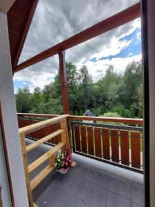 a balcony with a view of the trees at Pokój studio z balkonem in Grywałd