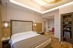 Cama ou camas em um quarto em Hotel Giolli Nazionale