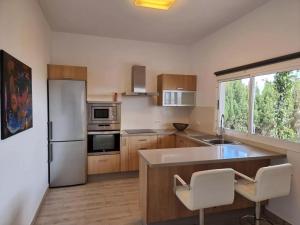 Η κουζίνα ή μικρή κουζίνα στο Casa Abubilla, Tu Refugio con Jardín y Terraza en el Corazón de Lanzarote +11 φωτογραφίες