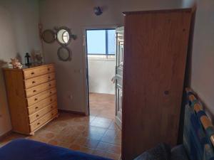 A bed or beds in a room at Casa marinera en la Orilla del mar