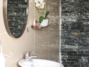 a bathroom with a sink and a mirror at The Bubble Valley clarens in Clarens